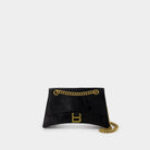 1000 BALENCIAGA BALENCIAGA CRUSH CHAIN SMALL BAG IN CROCODILE-EMBOSSED LEATHER. 
DIMENSIONS: L24.9 X H14 X W7.9 CM. 
49.8 CM LONG CHAIN SHOULDER STRAP. 
CURVILINEAR BOTTOM. 
AGED GOLD FINISH. 
STUDDED MAGNET