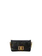 1000 BALENCIAGA BALENCIAGA BB SOFT SMALL FLAP BAG IN CALF LEATHER. 
REMOVABLE 89.9CM ADJUSTABLE SHOULDER STRAP. 
REMOVABLE 20.3CM GOLD CHAIN. 
AGED GOLD BB LOGO. 
SWIVEL CLASP. 
1 MAIN COMPARTMENT. 
1 INSIDE