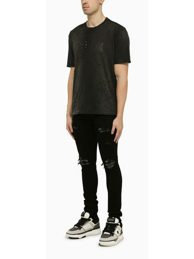 018 AMIRI  BLACK SKINNY JEANS WITH CAMOUFLAGE PATCHES