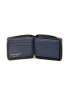 NAVY COMME DES GARÇONS WALLET NAVY LEATHER ZIPPED WALLET.