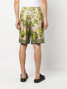 5G530 VERSACE Le Maschere print silk shorts